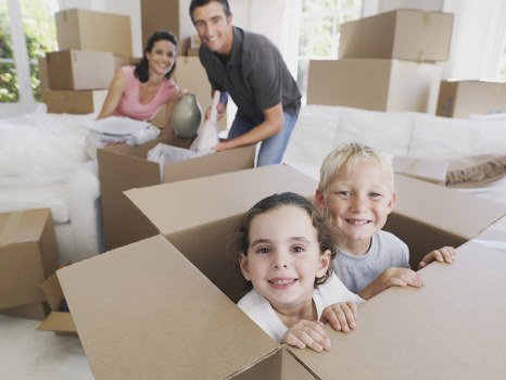 Removal team preparing a flat move in Plumstead with boxes and furniture
