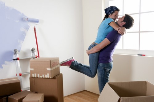 Professional movers handling household items in Plumstead